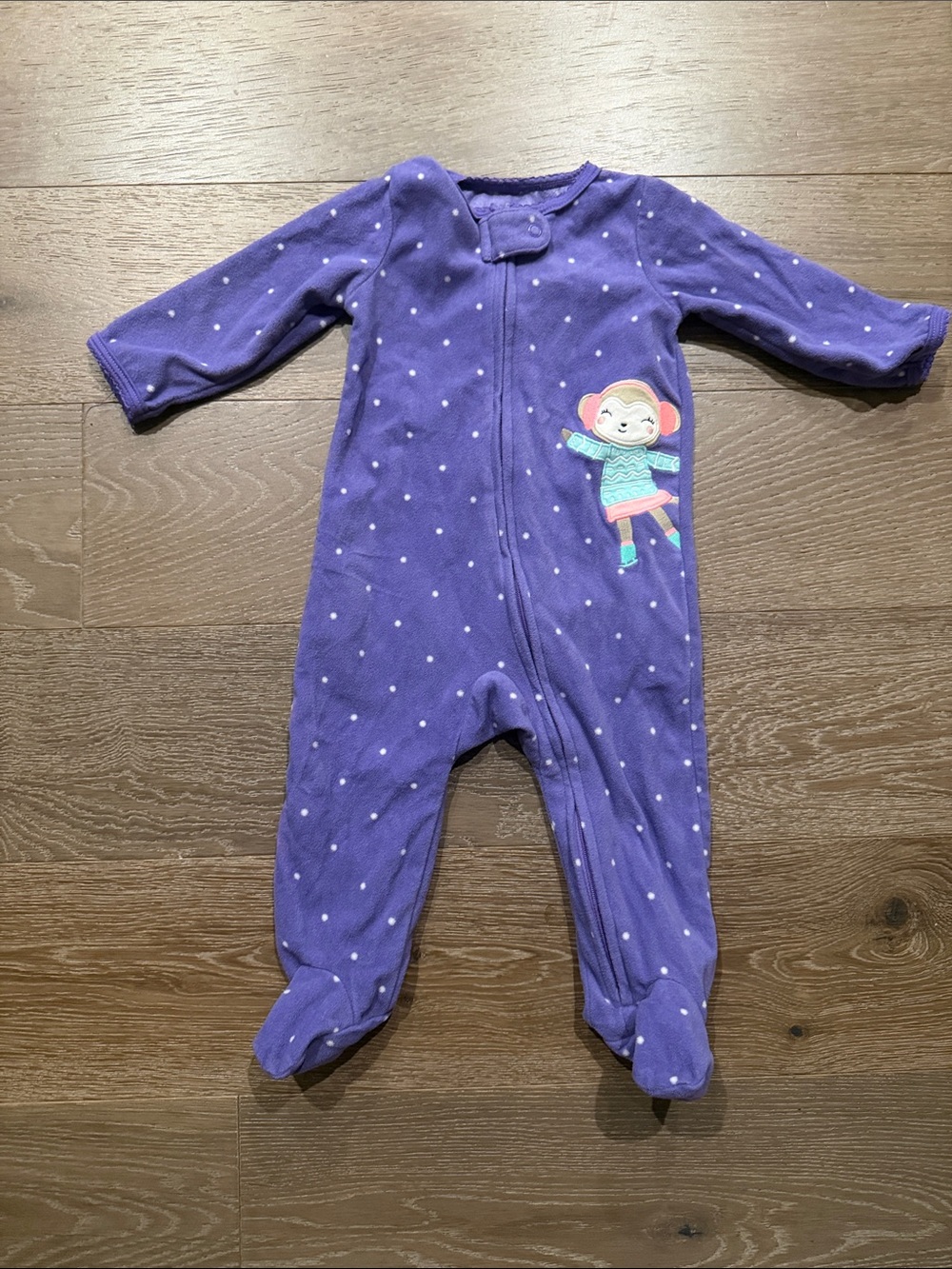 Carters purple polka dot fleece onesie. Size:9 Months. Gently Used.